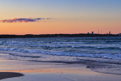 Scenic view of sea against sky during sunset