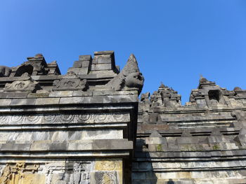 Low angle view of temple against clear blue sky in borobudur 