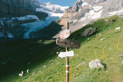 Information sign on snowcapped mountains