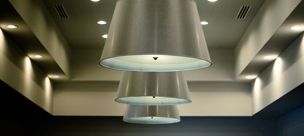 Low angle view of illuminated electric lamp