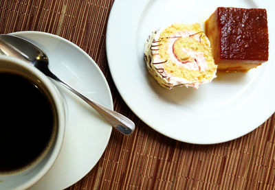 High angle view of dessert and coffee cup on table