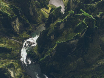 Scenic view of river amidst mountains