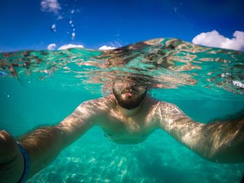 Close-up of man swimming in sea