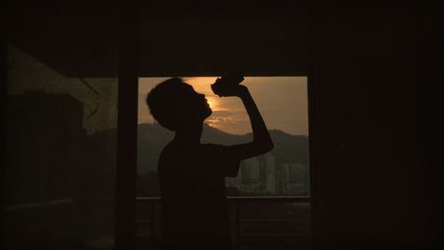 Shadow of silhouette people on window