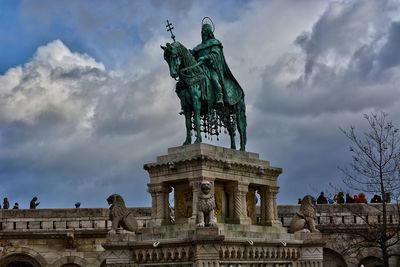 Low angle view of statue against cloudy sky