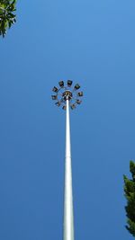 Low angle view of street light against clear blue sky