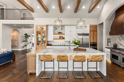 Kitchen in luxury home with large island and hardwood floors