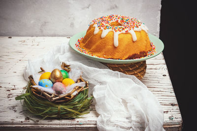 Various fruits in basket on table