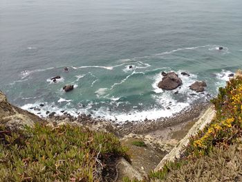 High angle view of rocks in sea