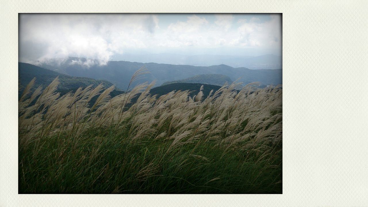 landscape, mountain, tranquil scene, scenics, tranquility, sky, transfer print, beauty in nature, mountain range, nature, grass, field, auto post production filter, non-urban scene, cloud - sky, cloud, idyllic, horizon over land, remote, hill