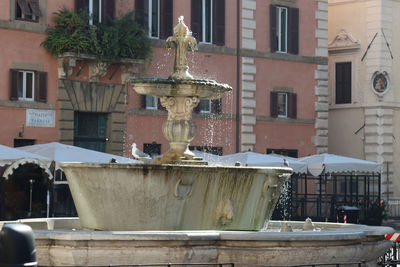 Fountain in old building in city