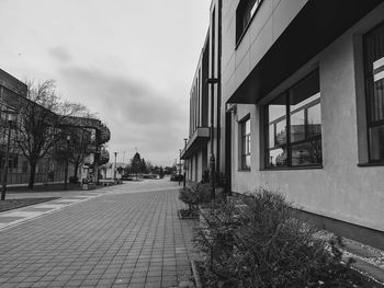 Street amidst buildings against sky