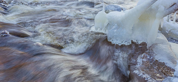 Cropped hand of person washing water