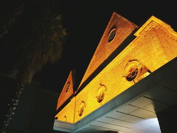 Low angle view of building against sky at night