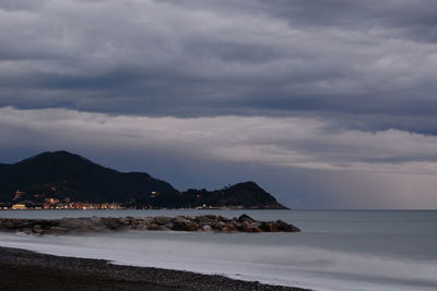 Cloudy dusk on sestri levante promontory. cavi di lavagna. liguria. italy