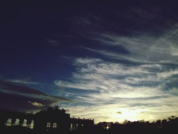 Low angle view of cloudy sky at sunset