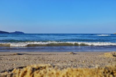 Scenic view of sea against clear blue sky