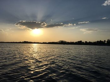 View of calm sea at sunset