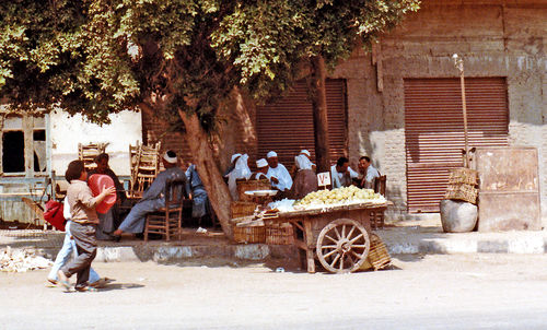 Two men in front of building