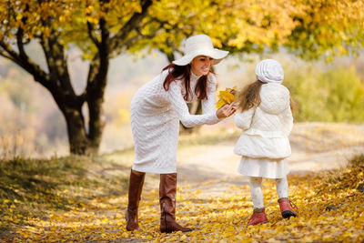 Full length of mother with daughter at park