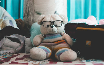 Stuffed toy on sofa at home