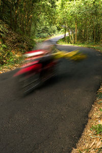 Blurred motion of car on road