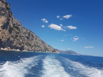 Scenic view of sea against blue sky