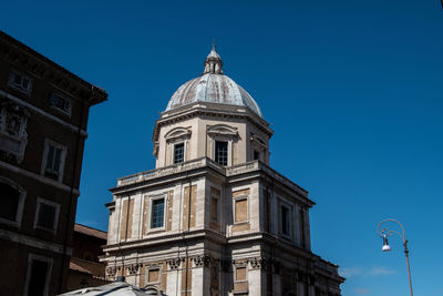 Low angle view of building against clear blue sky