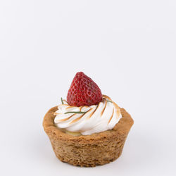 Close-up of cake on white background