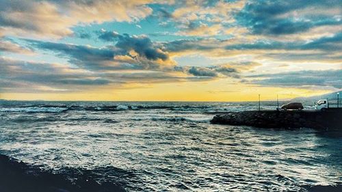 Scenic view of sea at sunset