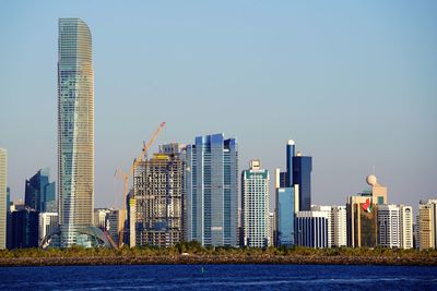 Skyscrapers in city against clear sky