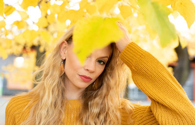 Portrait of young woman with yellow hair