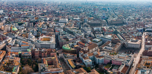 Aerial view of piazza duomo in front of the gothic cathedral in the center.