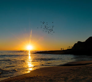 Scenic view of sea at sunset