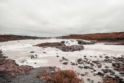 Scenic view of water flow against sky