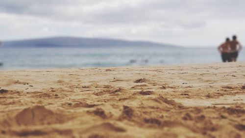 Surface level of beach against sky