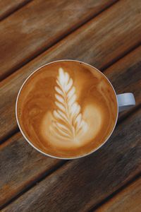 High angle view of cappuccino on table