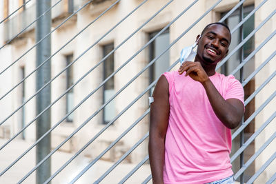 Young black man vaccinated showing his arm