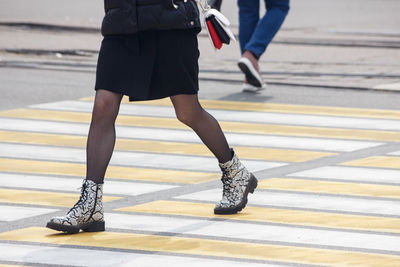 Low section of woman wearing high heels