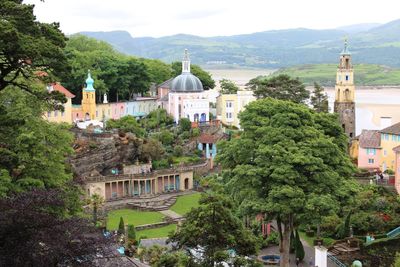 High angle view of building and trees in city