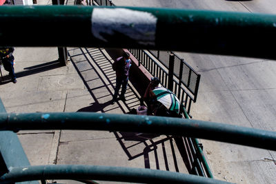 High angle view of people walking on staircase