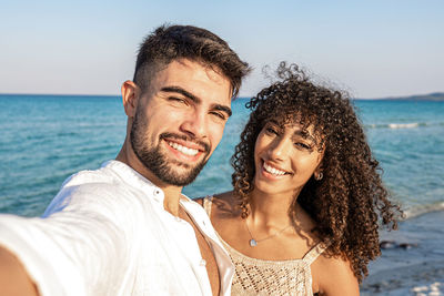 Portrait of smiling woman on beach