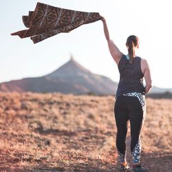 Full length of man standing on land against sky