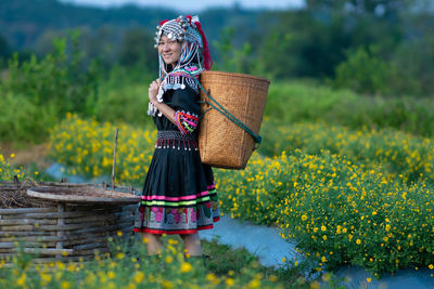 Full length of woman standing on field