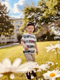 Full length of boy standing on field