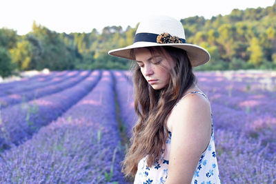 Young woman standing on field