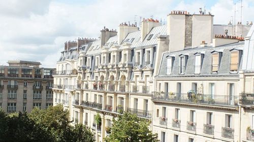 Buildings in city against sky