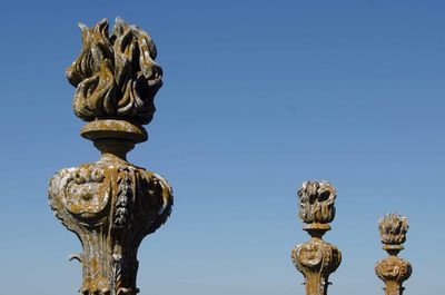 Low angle view of built structure against clear blue sky