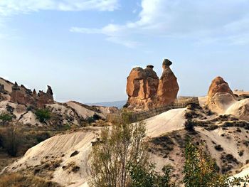 Panoramic view of rock formations against sky