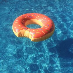 Close-up of donut shaped inflatable ring on swimming pool